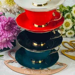 The Plain Black Teacups and Saucers