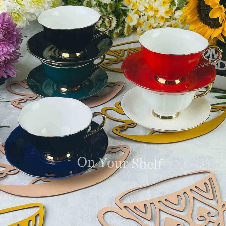 The Plain Black Teacups and Saucers
