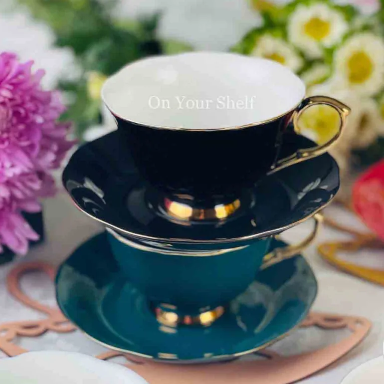 The Plain Black Teacups and Saucers
