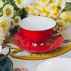 The Plain Red Teacups and Saucers